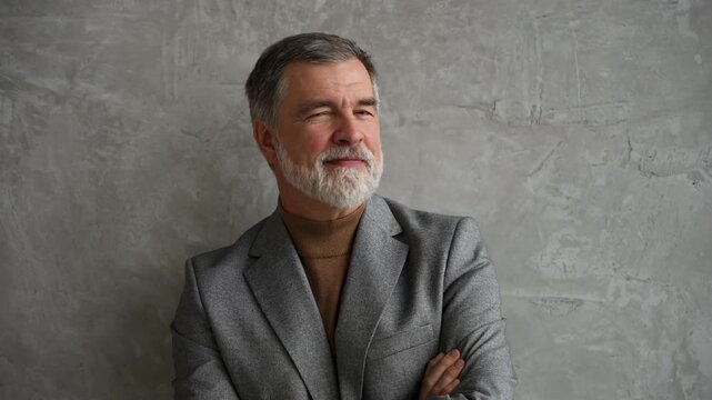 Success concept. Stylish bearded man in a suit in modern office