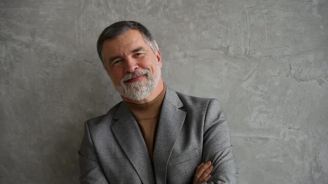 Success concept. Stylish bearded man in a suit in modern office