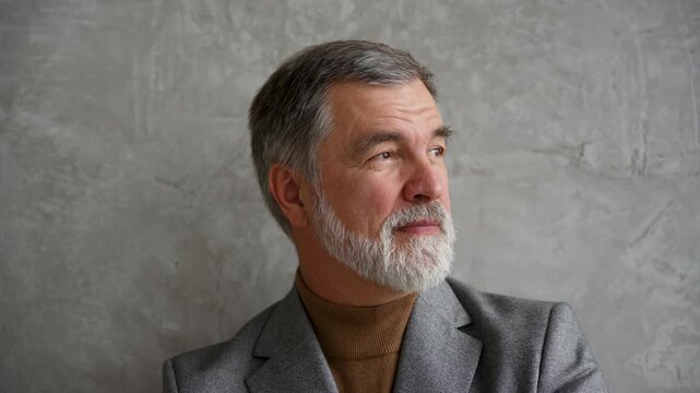 Success concept. Stylish bearded man in a suit in modern office