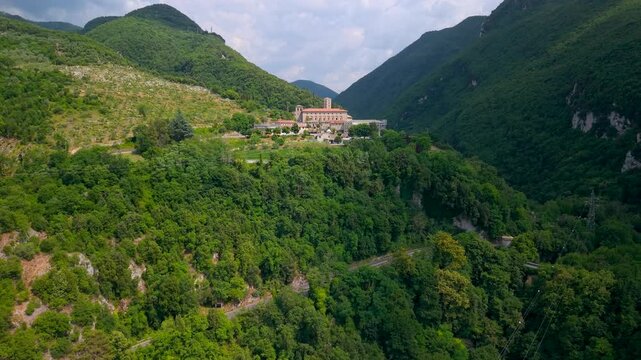 Santa Scolastica Monastery Subiaco Italy Aerial Drone Flight over Vineyard Orbit Benedictine Abbey Isolated in Green Mountain Gorge Lazio Historic Medieval Castle Complex Travel Footage 4K hidden gems