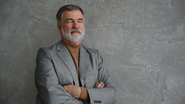 Success concept. Stylish bearded man in a suit in modern office