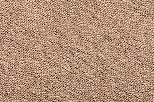 Macro close-up of a beige AUREA SILK fire-retardant fabric, 72% PVC 25% cotton 3% polyurethane, revealing fine woven fiber detail up close.