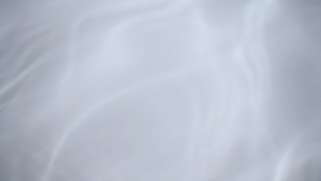 Full frame wide shot of white water in natural daylight with smooth waves and rippled surface. Concept 3D illustration plate background.