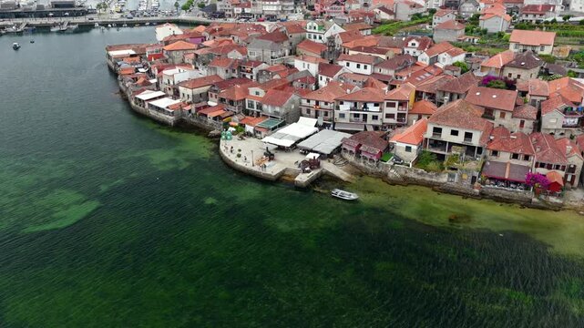 Aerial Drone View of the Coastline and Traditional Stone Horreos in the Historic Village of Combarro Galicia