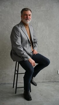 Success concept. Stylish bearded man in a suit in modern office