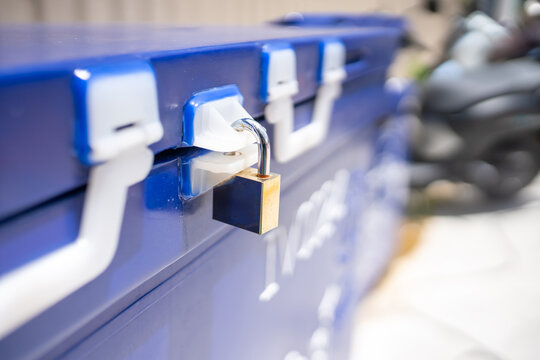 Secure Lock on Blue Mailbox for Safety