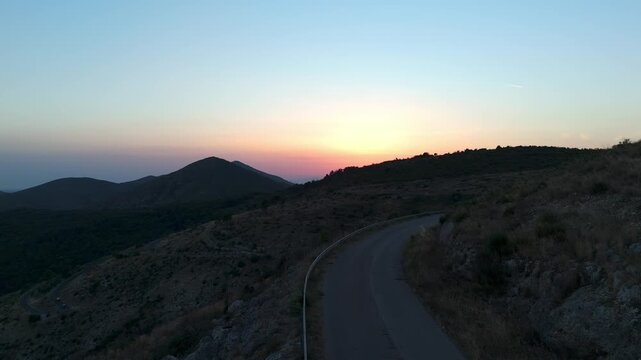 Drone View of a Winding Mountain Road at Sunset Near Casertavecchia, Italy