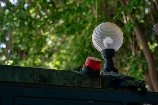 Outdoor Security Light with Flat Globe and Red Sensor