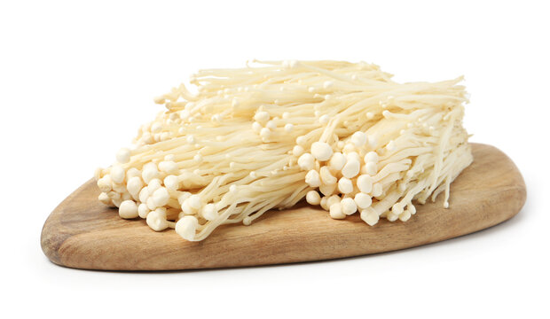Clusters of raw enoki mushrooms isolated on white