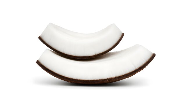 Two curved pieces of fresh coconut flesh stacked on a white background
