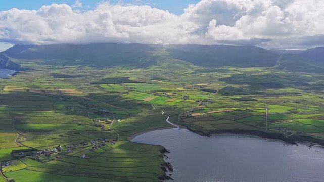 Aerial view of Feohanagh Bay beneath cloud-covered Mount Brandon, Ireland