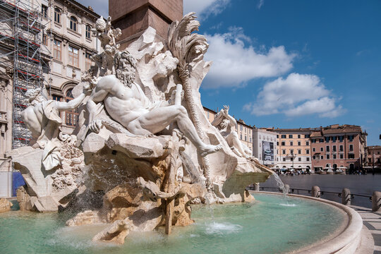 The Famous Fountain of the Four Rivers designed by Gian Lorenzo Bernini in Piazza Navona in Rome Italy on a Sunny Day