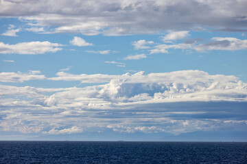 Fototapeta premium Calm Ocean Horizon With Layered Clouds Over the Strait Of Georgia, British Columbia, Canada