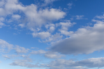 Obraz premium Soft Blue Sky With Fluffy White Clouds Cloudscape Over Calm Daylight Horizon