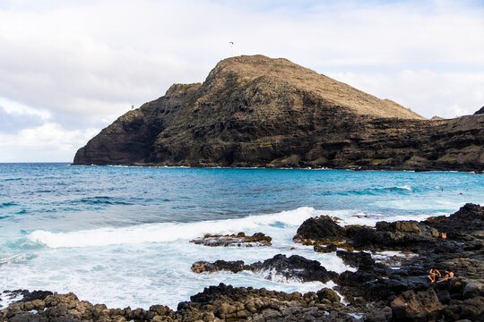 Rugged headland and turquoise water viewed from the ridge trail, Oahu