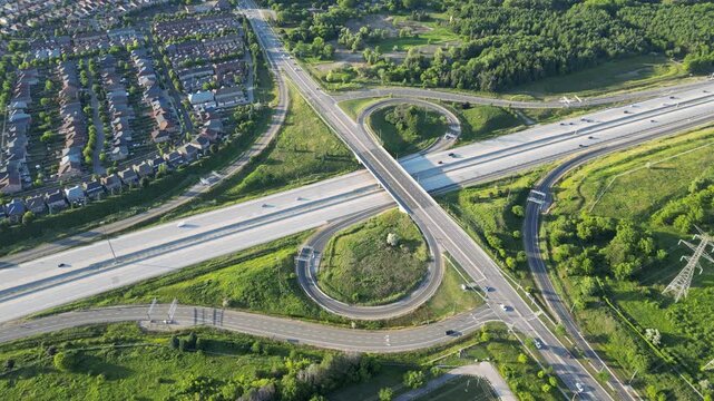 Aerial view of a highway interchange at sunset - Vue a&eacute;rienne d'un &eacute;changeur autoroutier au soleil couchant