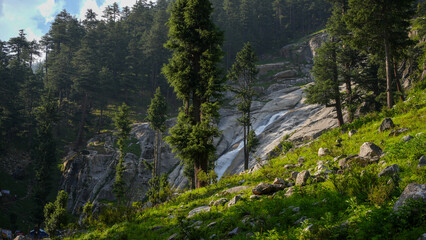 Forest waterfall cascade - Water cascades down a rocky forest slope in Kumrat, Khyber Pakhtunkhwa, Pakistan © JawadAhmedParas