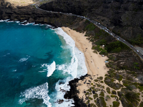 Aerial view of Makapuu Beach and the coastal road at sunset, Oahu