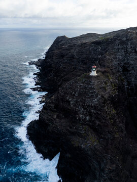 Aerial view of dark volcanic cliffs along the Makapuu coastline, Oahu