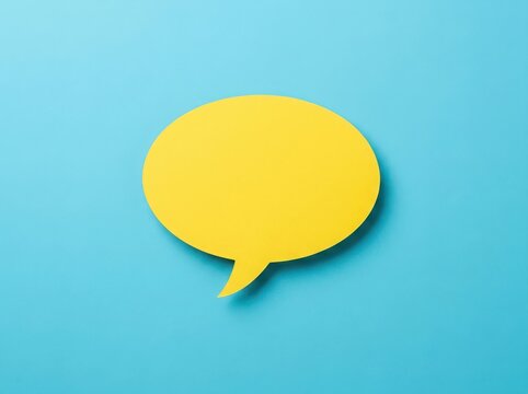 A bright yellow speech bubble icon on a light blue background