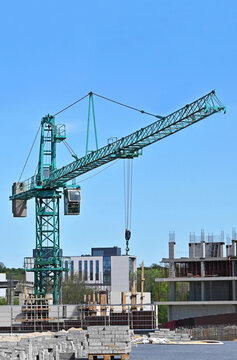 Construction site with crane and paving tile