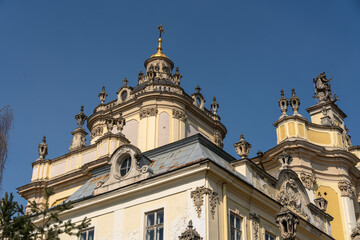 Obraz premium Baroque architecture with tall spires and detailed sculptures under clear blue sky