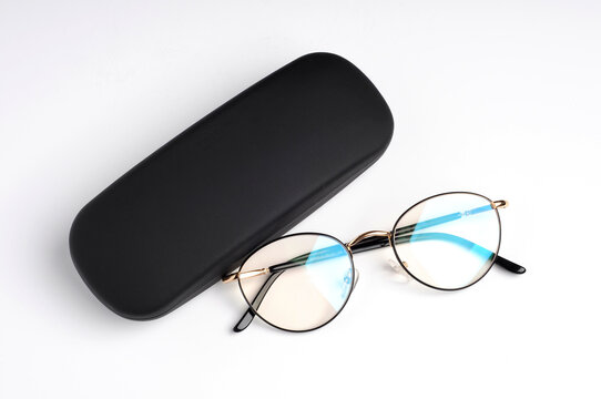 Glasses with black case top view on white