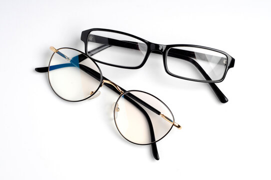 Two pairs of Spectacles flat lay on white