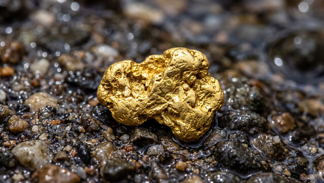 Extreme macro close-up of raw gold nugget texture, shiny yellow precious metal surface detail and wealth concept background.