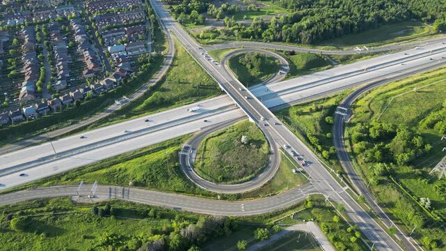 Aerial view of a highway interchange at sunset - Vue a&eacute;rienne d'un &eacute;changeur autoroutier au soleil couchant