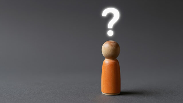 Wooden Figurine with Floating Question Mark &ndash; Minimalist Studio Scene for Introspection, Life Planning, and Search for Answers
