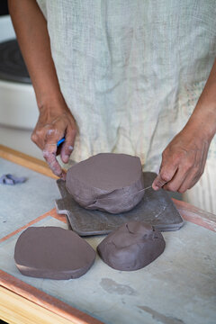 Potter holding clay 