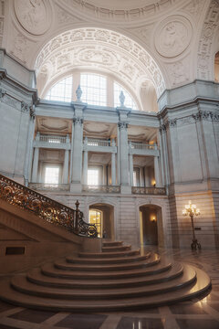 Elegant architectural details inside San Francisco City Hall, featuring ornate Beaux-Arts design, decorative columns, marble surfaces, intricate craftsmanship, and historic civic architecture.