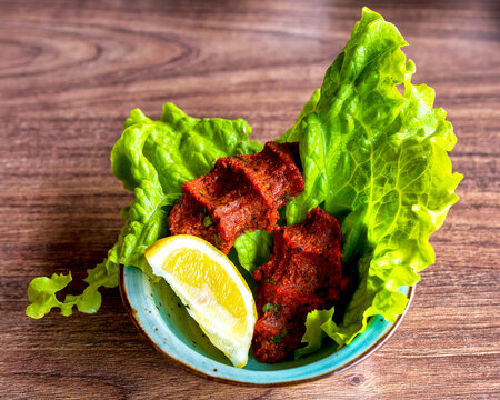 Cig Kofte with Lettuce and Lemon Wedge
