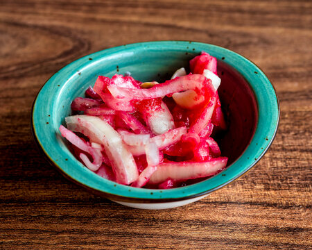 Pickled Onions With Cherry Sauce In Bowl