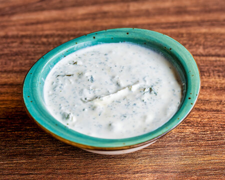 Turkish Suzme Yogurt With Herbs In Bowl