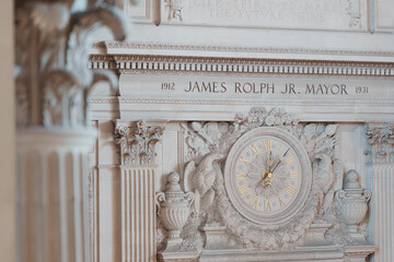Elegant architectural details inside San Francisco City Hall, featuring ornate Beaux-Arts design, decorative columns, marble surfaces, intricate craftsmanship, and historic civic architecture. © Glebstock
