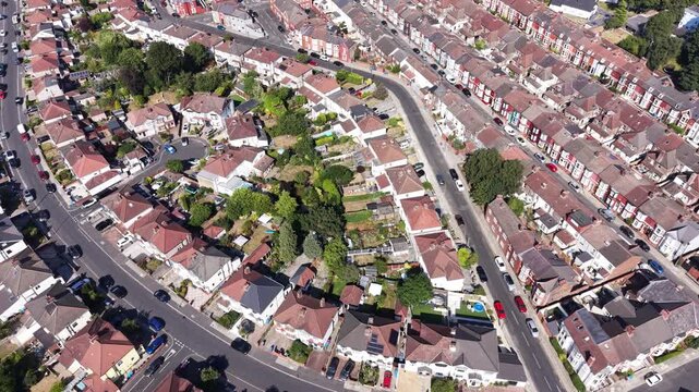 Aerial drone 4K clip showing Liverpool residential blocks glowing under strong daylight with vivid highlights across the area Liverpool