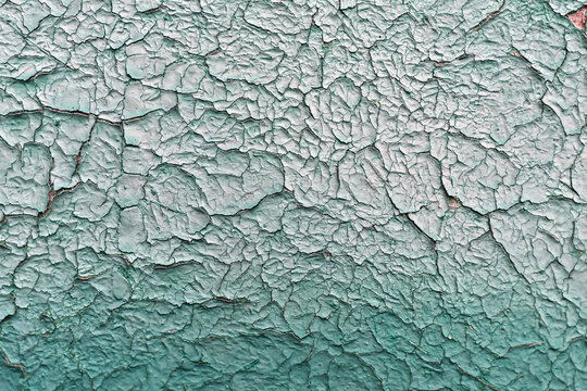 Old vintage cracked wall, peeling paint. Aged surface, background. Wallpaper for designer. Vintage texture.