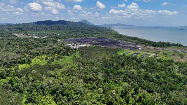 Coal is stockpiled and transported at the waterfront in Kotabaru, South Kalimantan