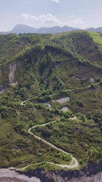 Rocky coastline and green cliffs aerial landscape. Flysch Begiratokia - Baratzazarrak. Deva, Gipuzkoa, Spain.