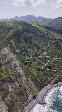 Rocky coastline and green cliffs aerial landscape. Flysch Begiratokia - Baratzazarrak. Deva, Gipuzkoa, Spain.