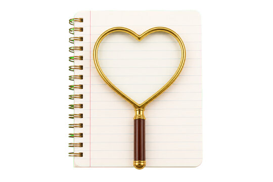 Heart shaped magnifying glass on spiral notebook
