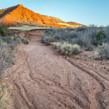 Sunset light over gravel trail in Red Mountain Open Space in northern Colorado