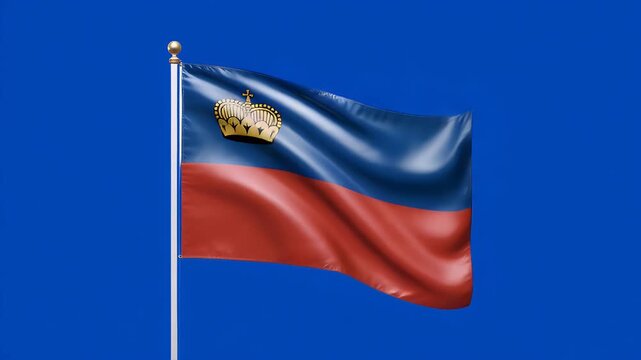 Liechtenstein flag waving proudly in the wind against a plain blue screen background&nbsp;symbolizing national pride and identity in Europe