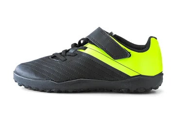 Black and neon yellow turf soccer shoe isolated on white background, side view © ValentinValkov