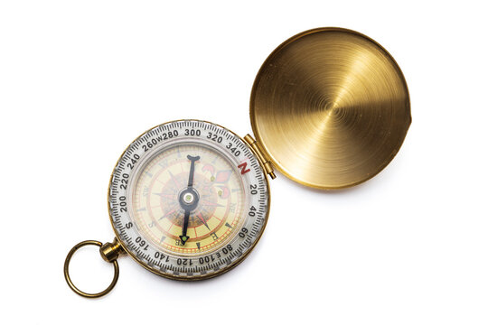Open vintage brass pocket compass isolated on white background