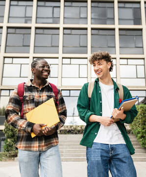 African American Student going out of school Laughing after classes and University exams