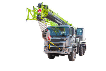 Modern crane truck with extended boom on white background, showcasing sleek design, heavy-duty chassis, vibrant green boom arm, aerodynamic cab, six-wheeled chassis, strong engineering, professional © Mister