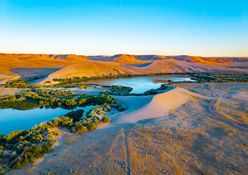 Golden sunset light over Bruneau Dunes State Park